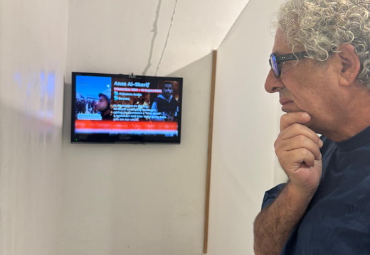 Shalom reading the plaque